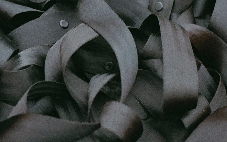 A close up view of a pile of seatbelts