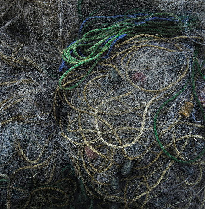 A huge pile of discarded fishnets that have been pulled out of the ocean