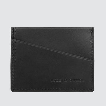 Back view of a black leather card holder made from upcycled car seat leather