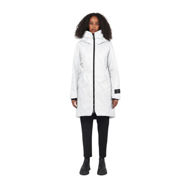 A model wearing a white mid-length hooded parka jacket with black trim and black pants, standing against a solid white background.