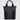 Tote bag made with grey twill material. There is a vertical black zipper on the left side, and the black seatbelt straps continue all the way down the front of the bag