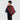 A male model carries the red twill bag slung over his back