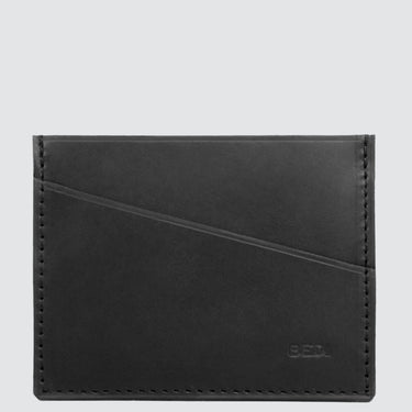 A durable cardholder made from black leather upcycled from car seats