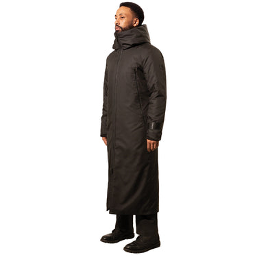 A man wearing a classic long black winter coat with a hood