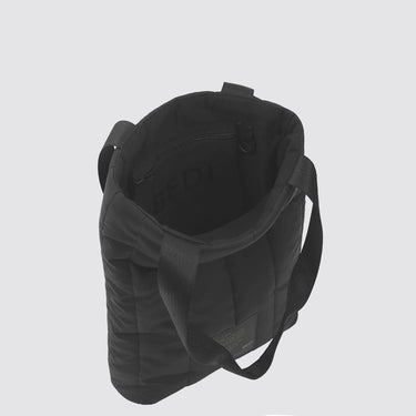 top view of a black puffer tote, open to show the interior with a black Bedi logo and zip pocket
