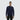 Male model wearing a black crewneck against a white background