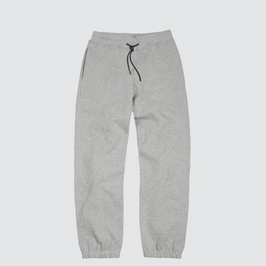 a pair of grey sweatpants against a light grey background