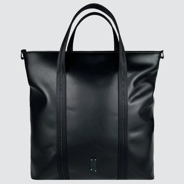 A medium-sized black leather tote bag made with upcycled leather and seatbelt straps
