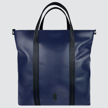 A medium sized navy blue leather tote bag, made with sustainable materials