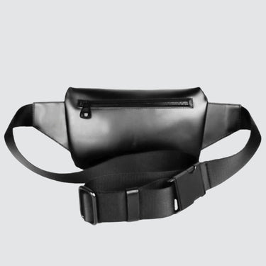 back view of a uilitarian style traditional fanny pack made with Upcycled leather on a whie background.