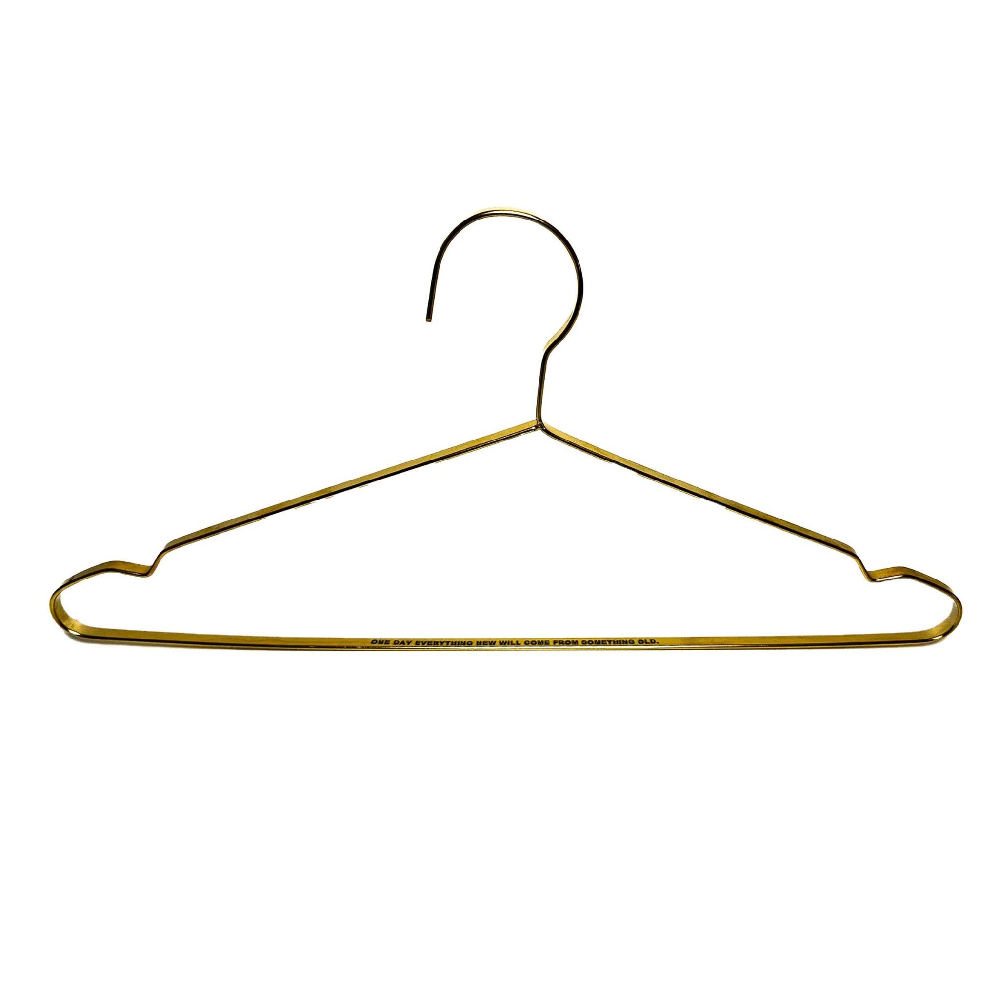 front view of one brass engraved hanger on a white background