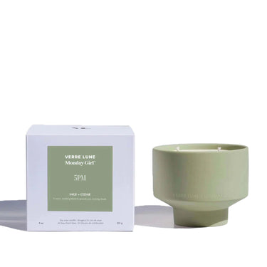 Verre Lune 5pm candle (collaboration with monday girl) on the right and its packaging on the left. Product is placed in front of a white background