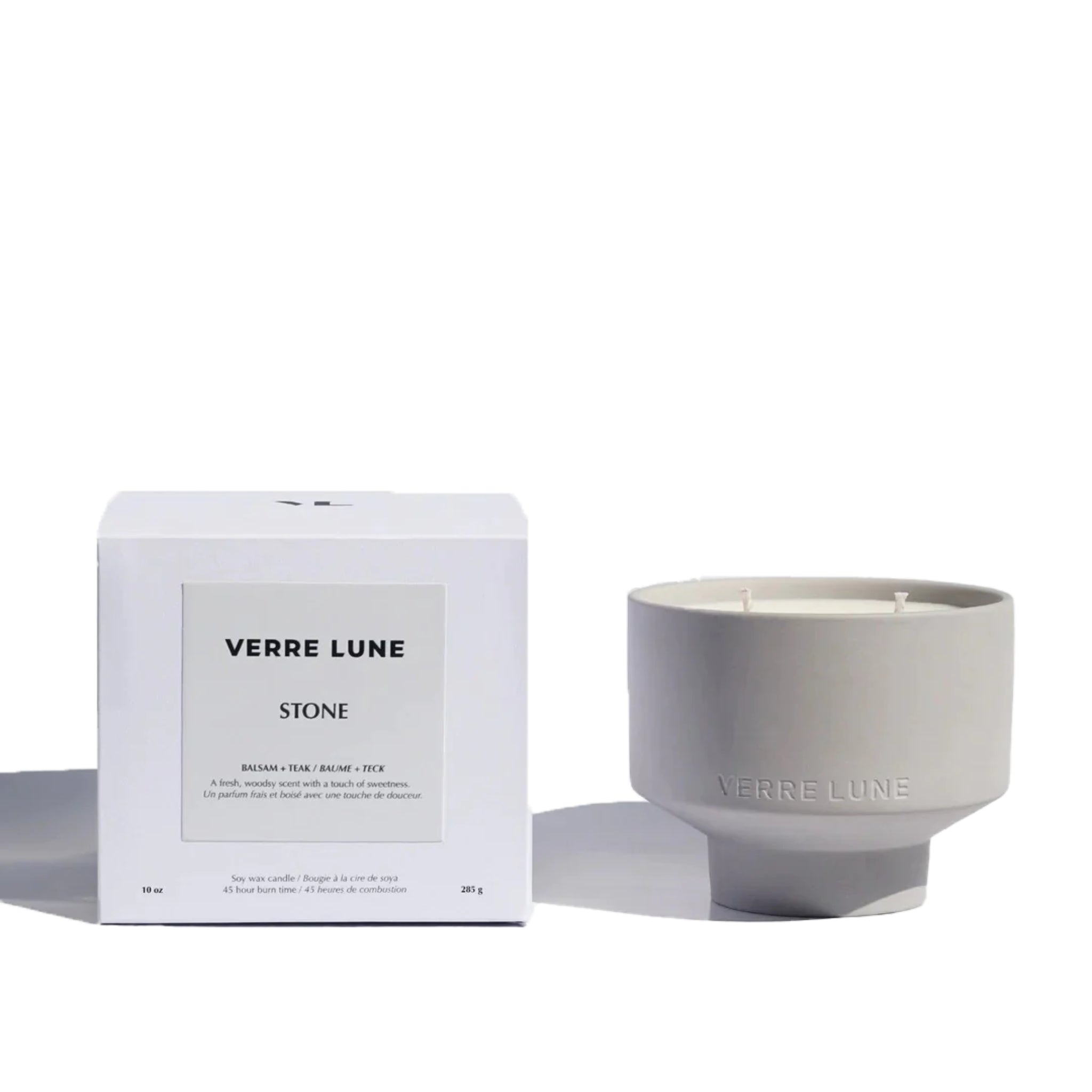 Verre Lune candle called stone (right) with its packaging (left) on a white background.