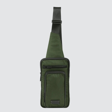 Front view of a utilitarian style sling in green upcycled nylon material on a white background