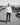Inder Bedi standing in the middle of a car scrapyard, looking at the camera.