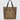 A tan nylon tote bag with black medium-length straps and a black patch with gold logo text