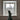 a pair of feet in green warm wool socks propped up in front of a window with a snowy scene outside