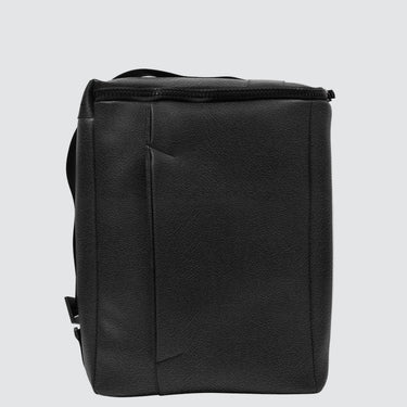 Black backpack on a light gray background