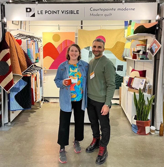 Founder of BEDI Studios; Inder Bedi, posing with Canadian artisan from "le point visible" at the One Of A Kind Show in Toronto