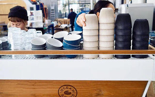a coffee place offering reusable cups to their customers 