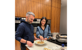 Inder Bedi and his daughter cooking vegan dumplings