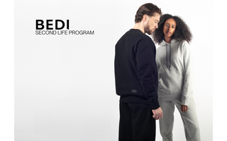 editorial of two models posing in loungewear male wears black (left) female wears grey (right), the title words "Bedi Second Life Program" appears to their right on the grey background