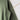 Green fabric with a small stain on a white background