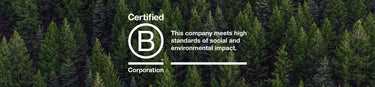 The B Corp certified logo superimposed over an aerial view of a pine forest 