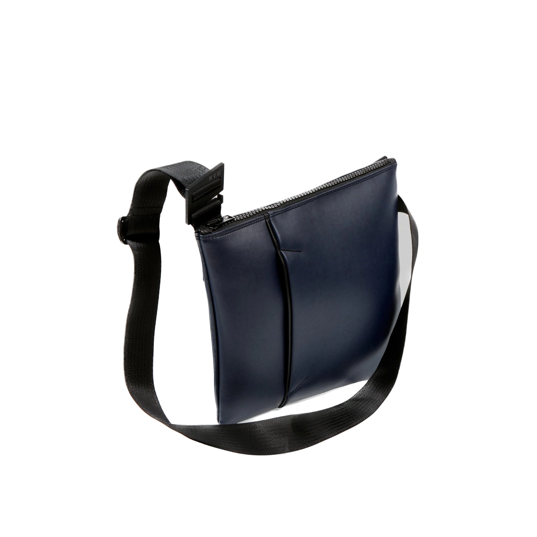 Another angle of the ANDO satchel in navy vegan leather (desserto). Product shown at the front/center of a white background
