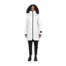 A model wearing a white mid-length hooded parka jacket with black trim and black pants, standing against a solid white background.