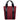 Tote bag made with red twill material. There is a vertical black zipper on the left side, and the black seatbelt straps continue all the way down the front of the bag