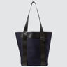 Medium sized navy tote bag, utilitarian style. On a white background.