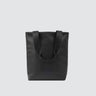 Back of utilitarian style medium sized tote in black vegan leather (Desserto)