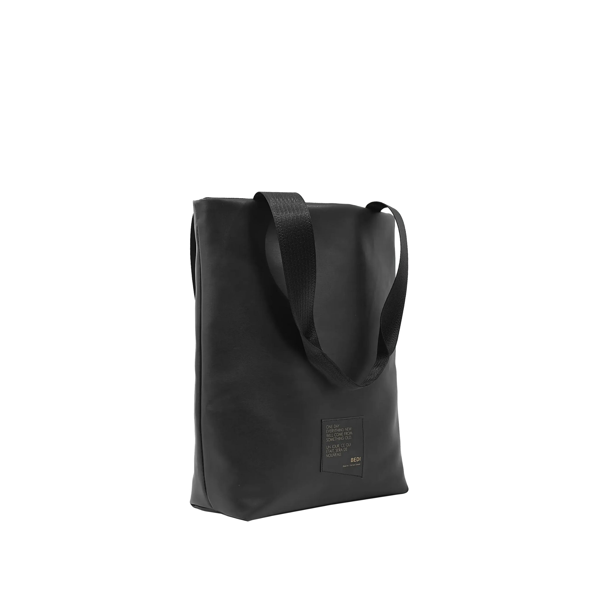 side profile of utilitarian style medium sized tote in black vegan leather (Desserto)