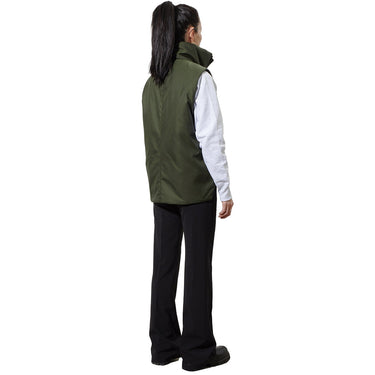 A woman models the back of a green nylon vest with a high collar