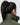 Close up view of the high neck of the green Montcalm vest, on a female model