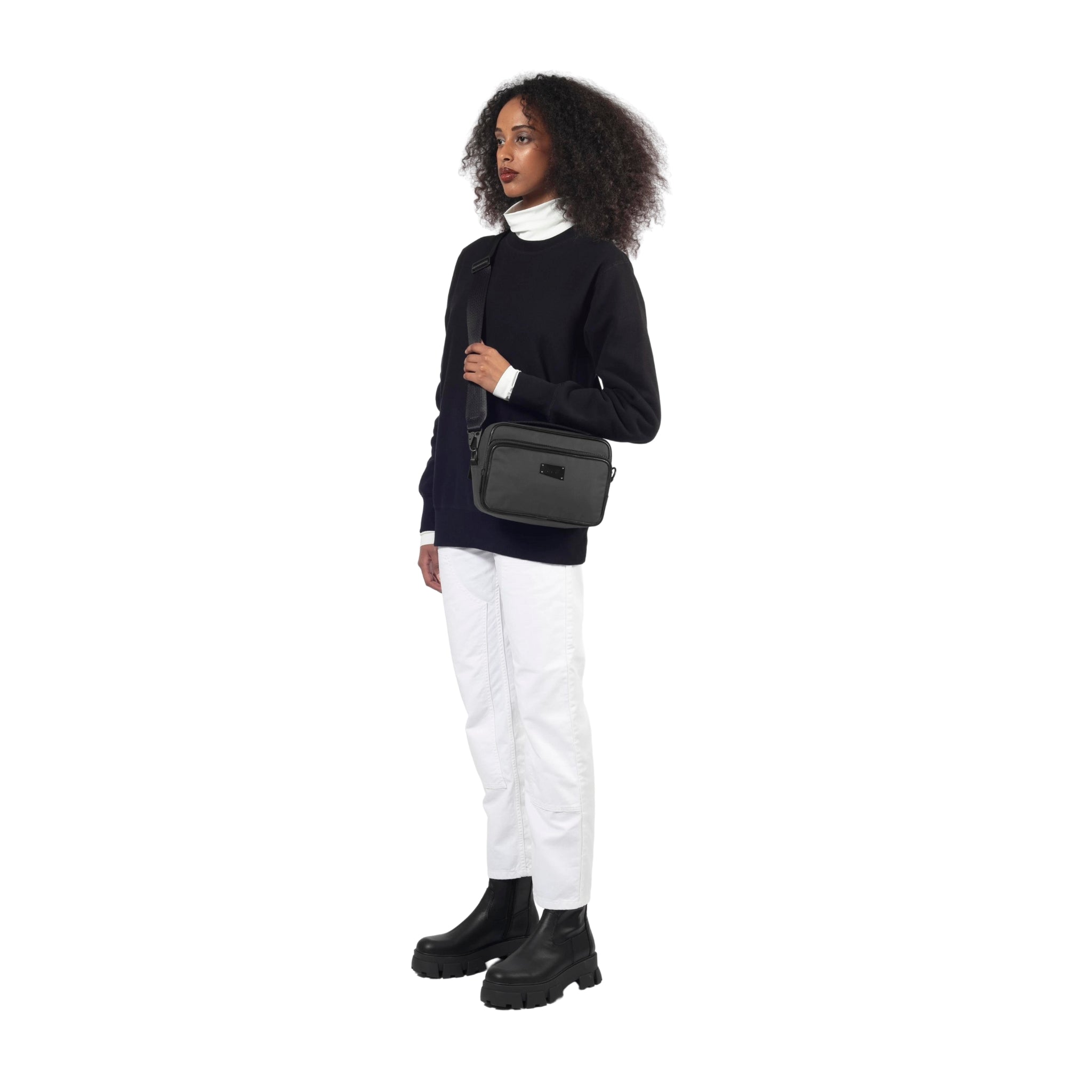 female side view of a Bedi' "second life" program grey camera bag against a white background
