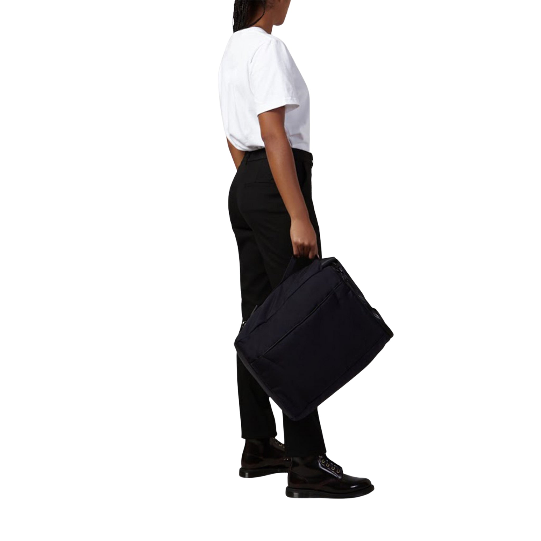 female side view of a Bedi' "second life" program navy utilitarian style backpack against a white background