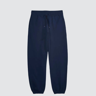 a pair of navy sweatpants against a light grey background