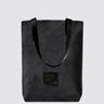 Simple black waxed canvas tote bag with black seatbelt straps
