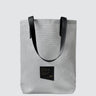 white tote bag made with textured patio furniture material and a black seatbelt strap