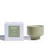Verre Lune 5pm candle (collaboration with monday girl) on the right and its packaging on the left. Product is placed in front of a white background