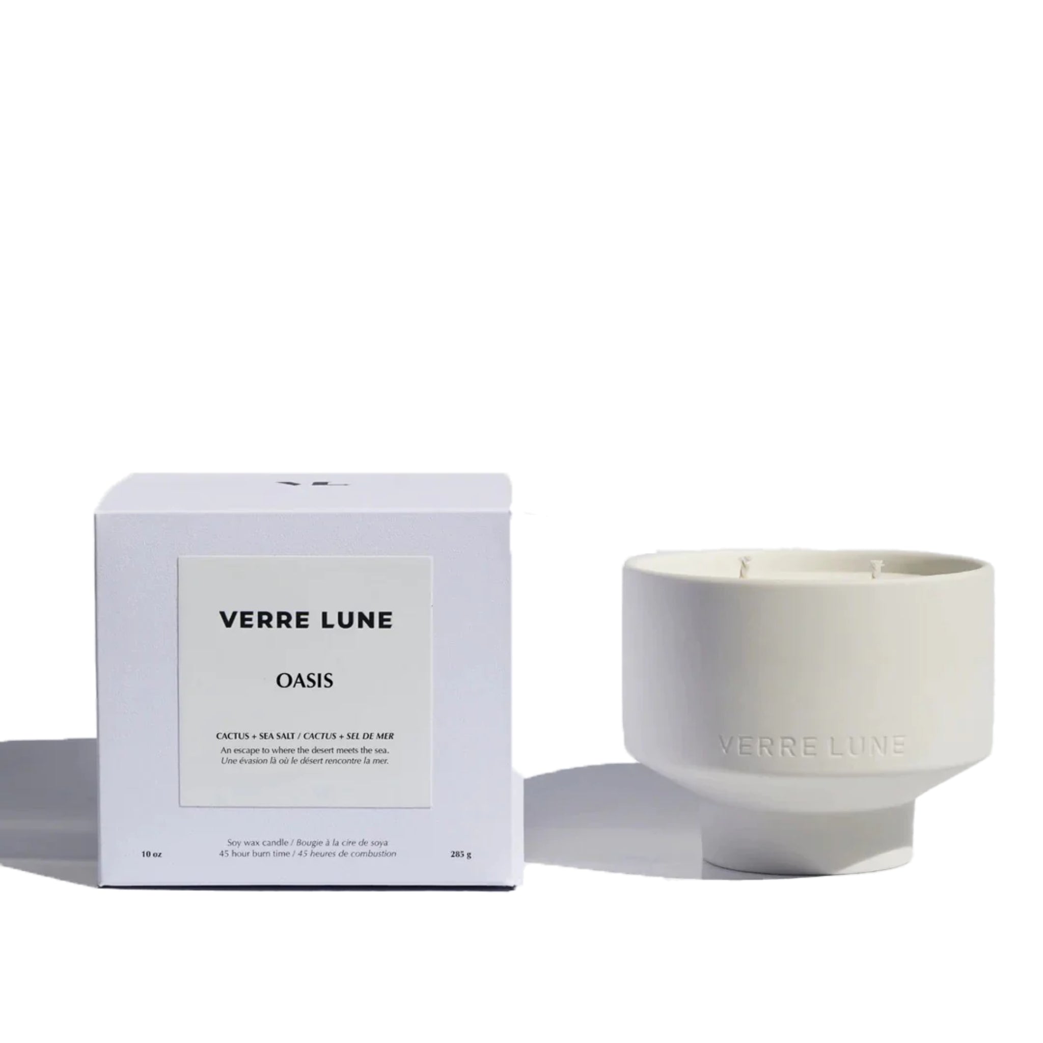 Verre lune oasis candle (right) and its packaging (left) on a white background