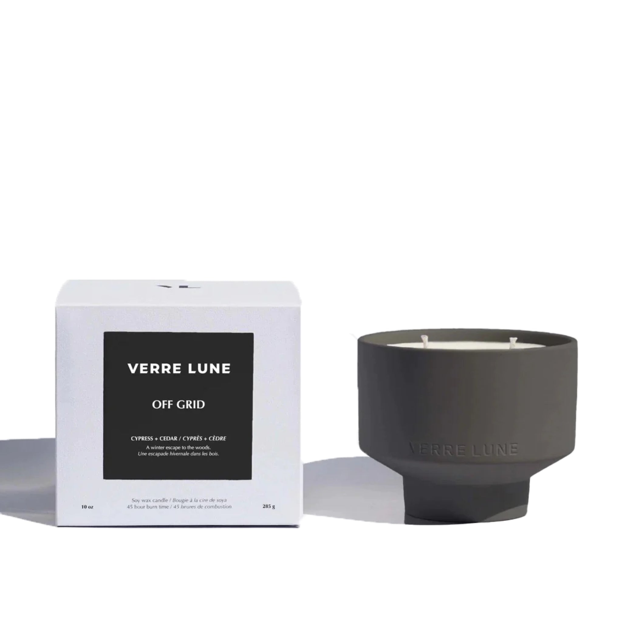 Verre Lune off grid scented candle (right) with its pakaging (left) on a white background