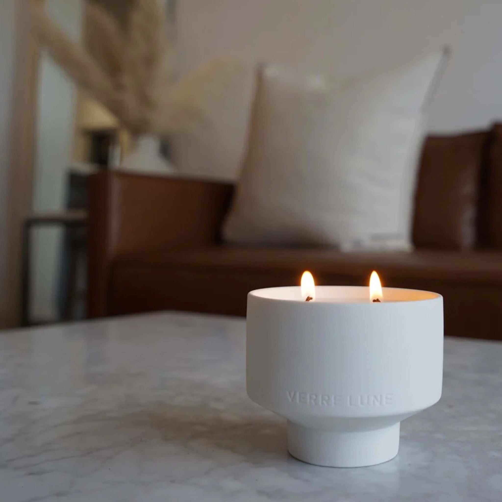 verre lune oasis candle lit in a living room setting