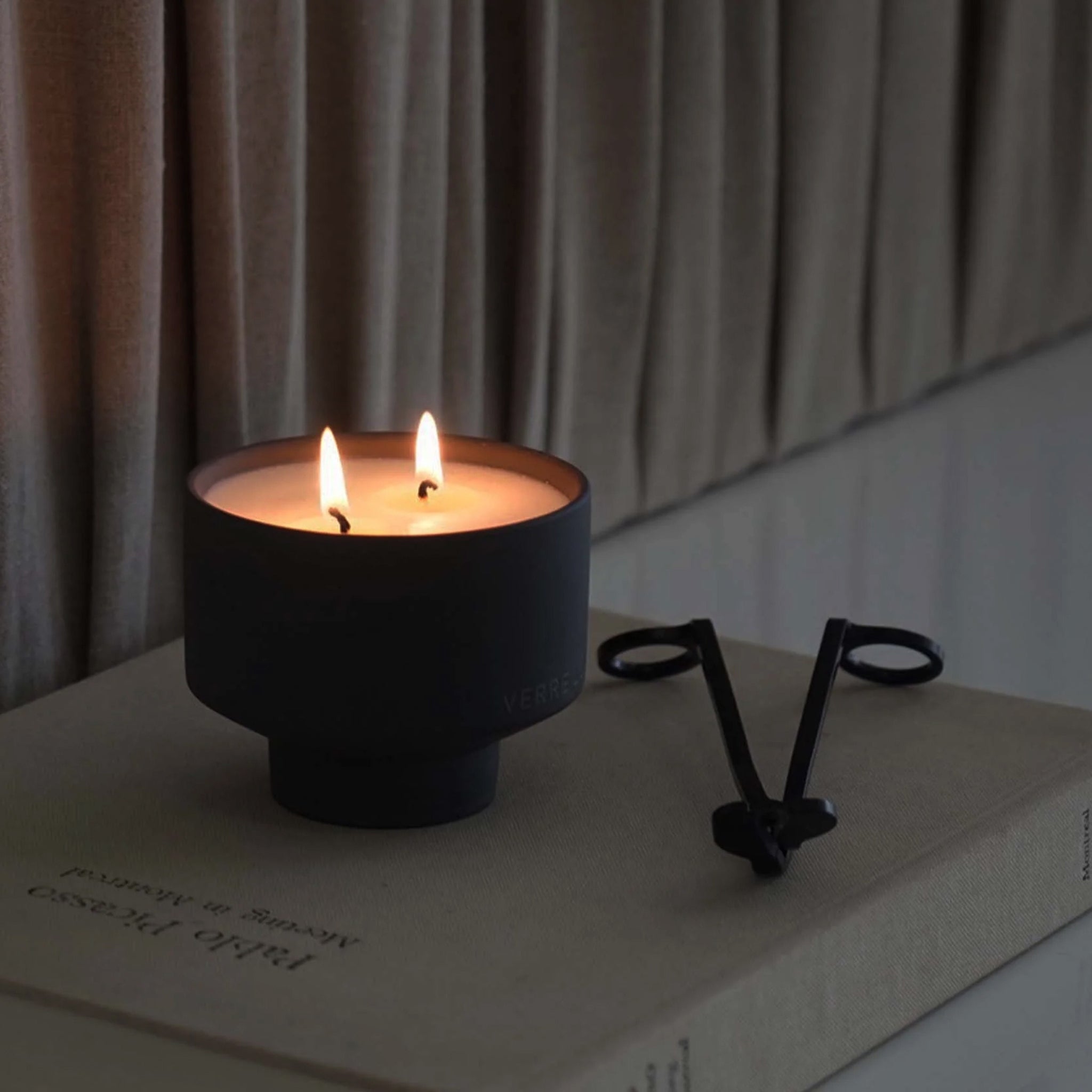 Lit Verre Lune off grid scented candle in a lounge calm setting 