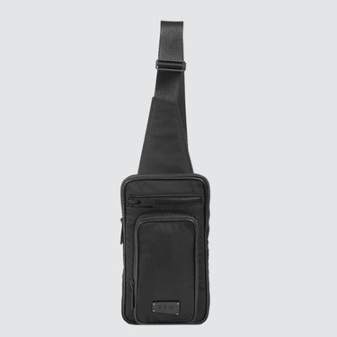 Face view of a utilitarian style sling in black upcycled nylon material on a white background.