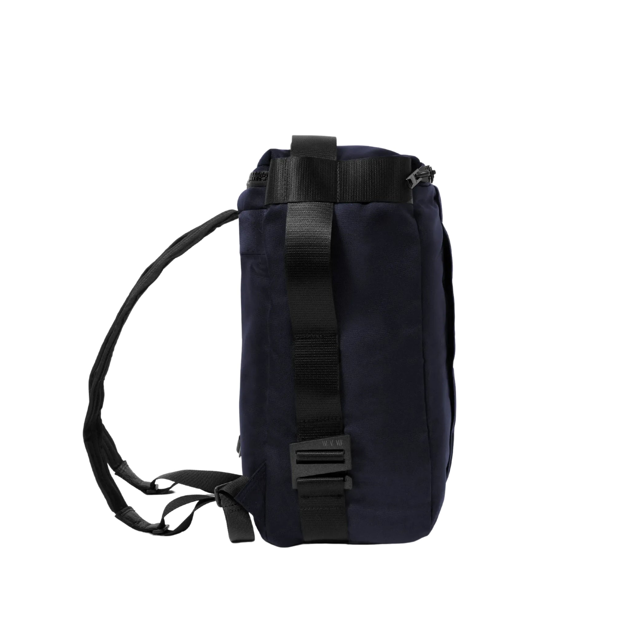 the side of an Interesting rectangular shaped backpack in navy upcycled material on a white background.