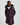 Woman wearing a dark purple coat with a hood on a light grey background