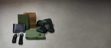 An assortment of small gifts, including socks, two wallets, two keychains and a beanie